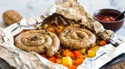 Sausages with vegetables in foil